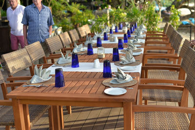 Chairs and table arranged at outdoor restaurant