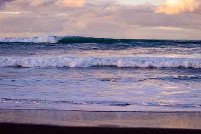 Waves in the atlantic ocean, before sunset, colorful sky, azores travel destination.