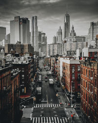 High angle view of city street and buildings against sky