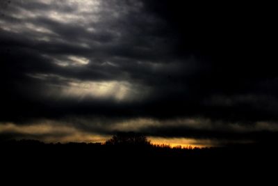 Scenic view of storm clouds in sky during sunset