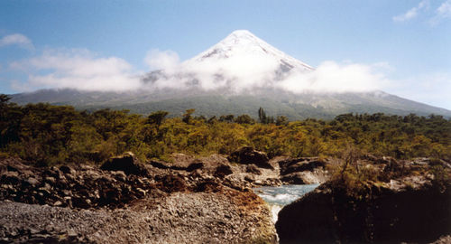 Scenic view of volcanic mountain against sky