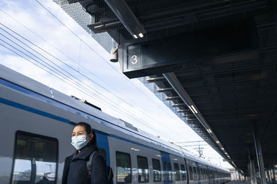 Woman on train station platform