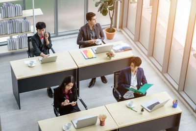 People sitting on table at home