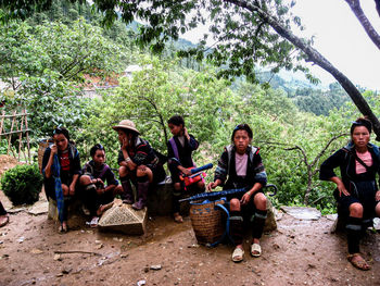 Group of people sitting outdoors