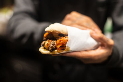 Midsection of woman holding food