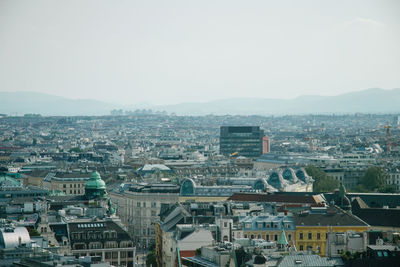 High angle view of buildings in city against clear sky