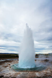 The great geysir, geyser in southwestern iceland, haukadalur valley, geyser splashing out of ground 