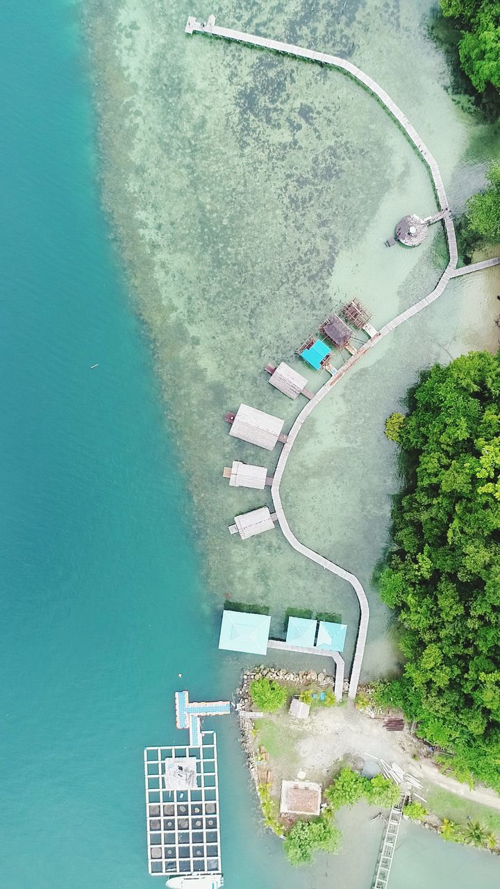 high angle view, water, plant, architecture, nature, day, tree, pool, no people, swimming pool, transportation, built structure, building exterior, city, outdoors, mode of transportation, sea, aerial view, directly above