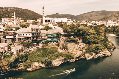 High angle view of townscape by river