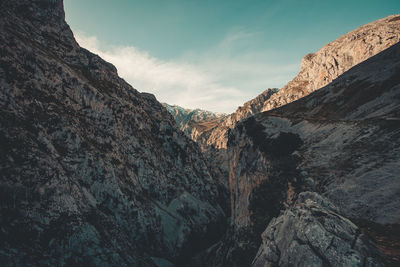 Rock formations on mountain against sky