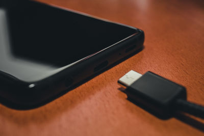 High angle view of smart phone on table