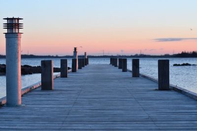 Wooden jetty leading to calm sea