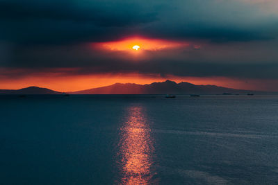 Scenic view of sea against sky during sunset at manila bay, philippines