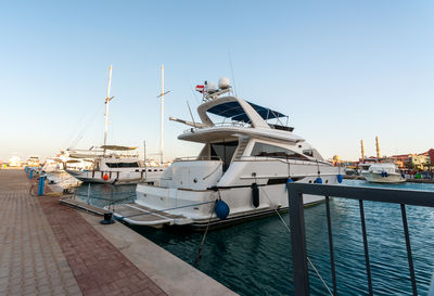 Boats moored at harbor