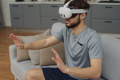 Portrait of young man using mobile phone