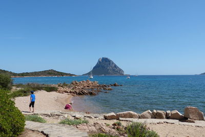 Scenic view of sea against clear blue sky