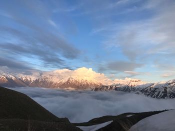 Scenic view of snowcapped mountains against sky