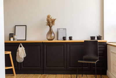 Cupboards with decorations in cozy room