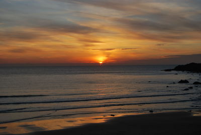 Scenic view of sea at sunset