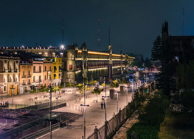 Illuminated buildings in city at night