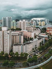 High angle view of buildings in city against sky