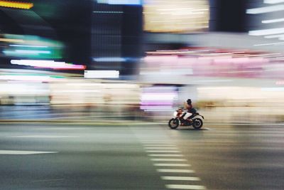 Blurred motion of motorcycle on street