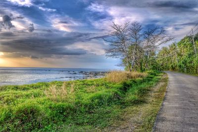 Scenic view of sea against cloudy sky