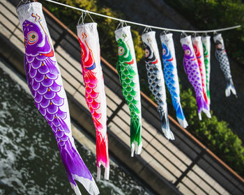 High angle view of windsocks hanging on clothesline