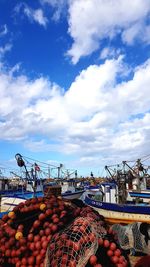 Stack of fishing net against sky