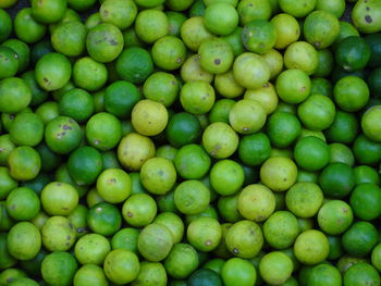 Full frame shot of green lemons 