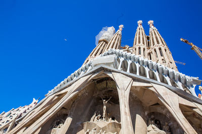 Low angle view of building against blue sky