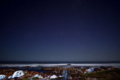 Scenic view of sea against sky at night