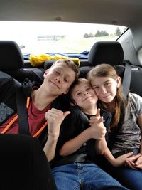 Friends sitting in car