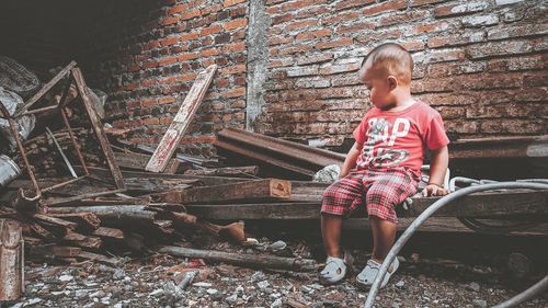 Full length of boy on wood
