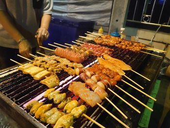 High angle view of meat on barbecue grill