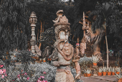 Statue outside temple against building