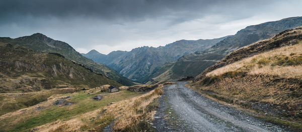 Panoramic view of road amidst mountains against sky