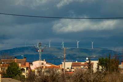 Panoramic view of wind power plant against the sky