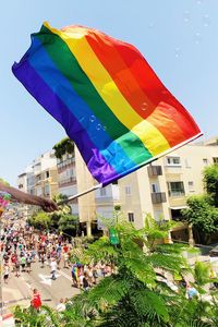 Group of people in front of building gay pride 