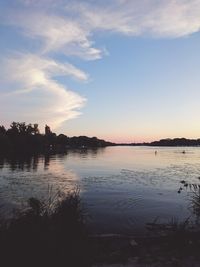 Scenic view of lake at sunset