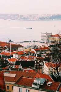 High angle view of houses and river in town