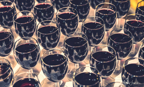 Close-up of wine glasses on table