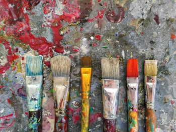 Directly above shot of paintbrushes on table