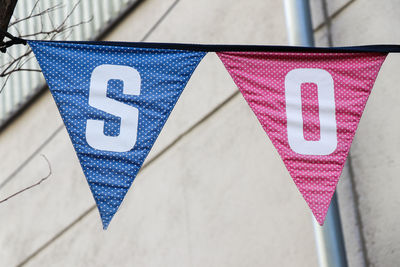 Close-up of triangle banners with letters