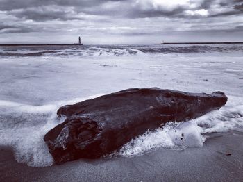 Scenic view of sea against sky during winter