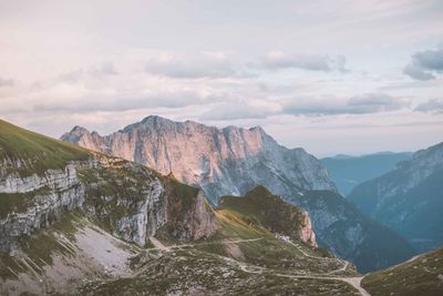 Scenic view of mountains against cloudy sky