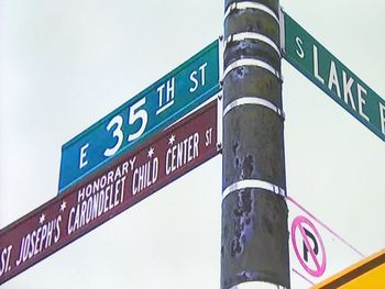 Low angle view of information sign against sky