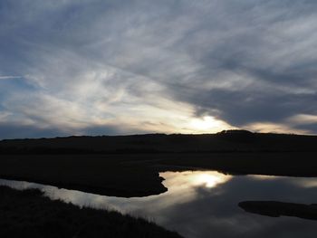 Scenic view of lake against sky during sunset