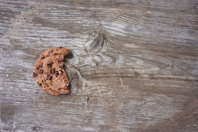 Directly above shot of chocolate cookie on wooden table