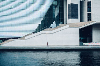 Modern buildings by sea in city
